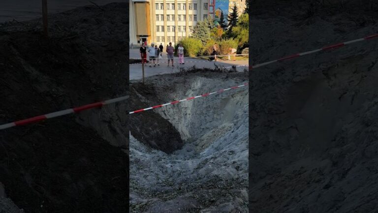 Фото для новини:A toddler is learning to walk beside the crater left after Russia’s attack on Ukraine